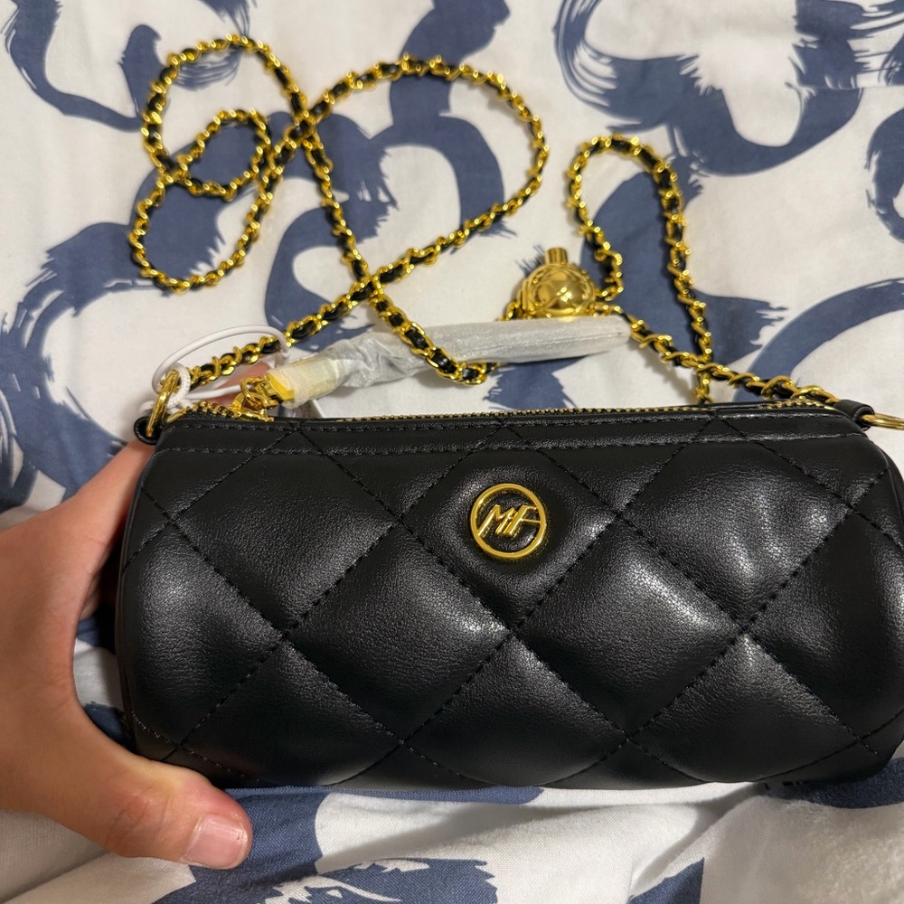 Black Cylinder Quilted Chain Crossbody Bag by Mark Fairwhale